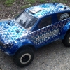 <strong class='magnific-title'>Slash the Magic Dragon</strong> Slash 4x4 with a Desert Raid body with dragon scales paint scheme, extended body mount kit, Trenchers tires mounted on Split Six Bead-Loc wheels. Pro-Line is the BEST!! I will never put any other body or tires on my trucks. Thank you Pro-Line.