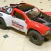 <strong class='magnific-title'>traxxas slash</strong> this is my slash with Pro-Line Trenchers and a new Silverado body. I also have a castle sct system and we have a track in the backyard with your banner on the driver stand.