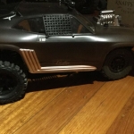<strong class='magnific-title'>Slash conversion</strong> Slash ultimate turned Mad Max.
Pro track kit, badlands tyres on the front and trenchers on the rear.
Pro-Line body extension mounts and thumb screw attachments. Pro-Line light mounts and axial light kit. Team Associated window nets. Chrome paint backed with black rusty/dusty brown painted on the outside and sprayed with clear matte finish to give the flat look. Go Pro mounted on the rear for some fun shots.